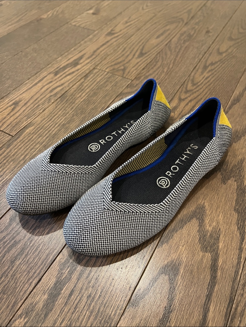 Rothy's Black & White Knit Flats with Yellow Heel and Blue Trim